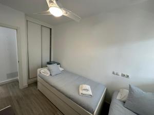 Posteľ alebo postele v izbe v ubytovaní Apartamento con jardín privado