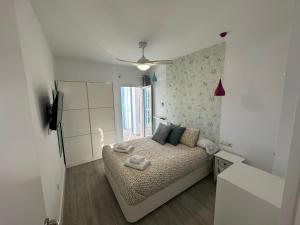 Posteľ alebo postele v izbe v ubytovaní Apartamento con jardín privado
