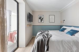Postel nebo postele na pokoji v ubytování Living Ascona Boutique Hotel