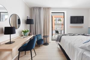 Postel nebo postele na pokoji v ubytování Living Ascona Boutique Hotel