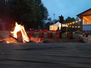 a fire pit in a park at night at Orme nel parco - Villaggio Grechi in Tirivolo