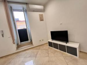 TV a/nebo společenská místnost v ubytování Esse House's Noto