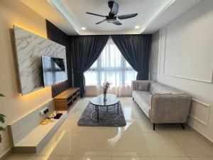 a living room with a couch and a table at Best for Family KLCC Pavillion Sunway Velocity MRT in Kuala Lumpur