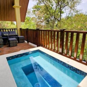 a swimming pool on the deck of a house at Cabaña de montaña en Altos del María in Sorá