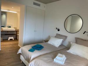 Posteľ alebo postele v izbe v ubytovaní A1 Magnifique appt 6 personnes Lofts de Ste Lucie