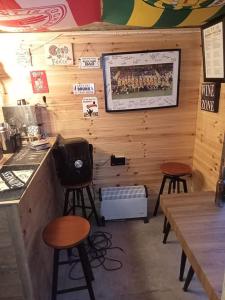 a restaurant with two bar stools and a counter at Bundoran seclusion in Bundoran