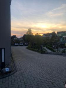 a parking lot with cars parked on a street at Moderne Wohnung mit 4 Betten in Bochum