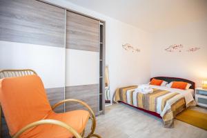 a bedroom with a bed and a sliding glass door at Murva in Posedarje