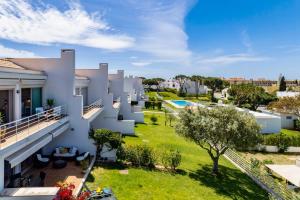 an aerial view of a house with a yard at Luxury Villa in Serene Location with Pool & Private Garden in Quarteira
