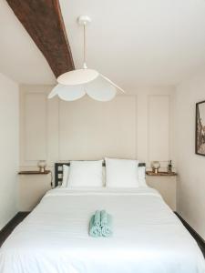Postel nebo postele na pokoji v ubytování Appartement vue sur château-fort 3 étoiles