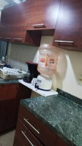 a kitchen counter with a mixer on a counter top at Habitacion privada in Tehuacán