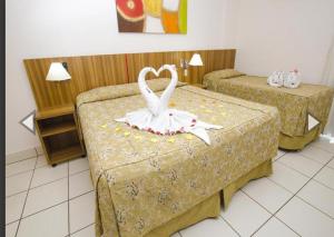 Ліжко або ліжка в номері DIROMA EXCLUSIVE Com entrada todos os dias para o Acqua Park e café da manhá