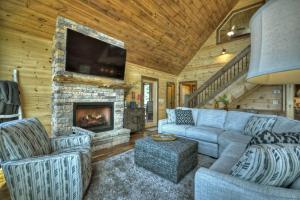 a living room with a couch and a fireplace at Sunset Ridge w Stunning 5 Star Views & Hot Tub in Blue Ridge