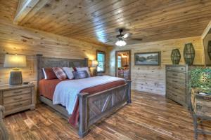 a bedroom with a bed and a wooden ceiling at Sunset Ridge w Stunning 5 Star Views & Hot Tub in Blue Ridge