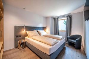 En eller flere senge i et værelse på Apartments Elmarino