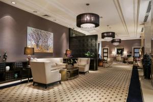 a lobby of a hotel with couches and chairs at Lugal, A Luxury Collection Hotel in Ankara