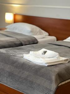 Ένα ή περισσότερα κρεβάτια σε δωμάτιο στο Nad Starą Nidą ***