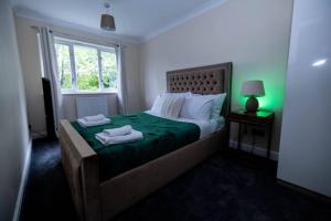 Katil atau katil-katil dalam bilik di Pristine Relocation House