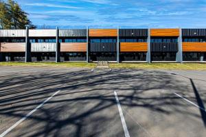 an empty parking lot in front of a building at Brand New Condo near downtown Nash w washer dryer in Nashville