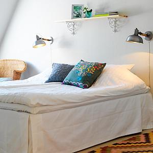 Rúm í herbergi á Gårdens & Apotekarns B&B