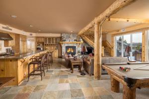 a kitchen and living room with a pool table at Big Bear Village View Haus is a large pet and kid friendly chalet with hot tub located a short walk to village in Big Bear Lake
