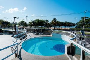a swimming pool on top of a cruise ship at Nobile Suites Diamond in Vitória