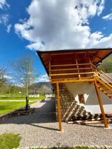 a building with a roof on top of it at Rafting Camp Konak in Foča