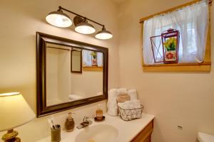 a bathroom with a sink and a mirror at Cozy Dolores Getaway Hike, Fish and More! in Dolores +20 photos