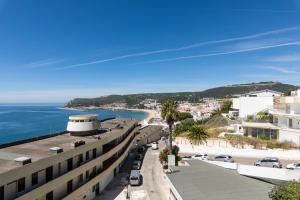 a view of the beach from a building at Sesimbra 1111 in Sesimbra