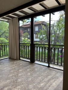 an empty room with large sliding glass doors at Santa Marina Apartment 503 in Sozopol