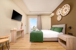Ένα ή περισσότερα κρεβάτια σε δωμάτιο στο Nicolas Grand Suites, Adults Only