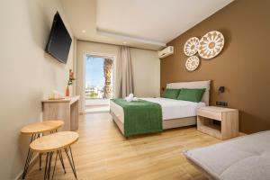 Ένα ή περισσότερα κρεβάτια σε δωμάτιο στο Nicolas Grand Suites, Adults Only