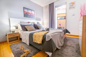 Posteľ alebo postele v izbe v ubytovaní Apartments Villa Tomaš