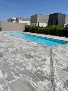 a swimming pool covered in snow and ice at La movida in Lattes