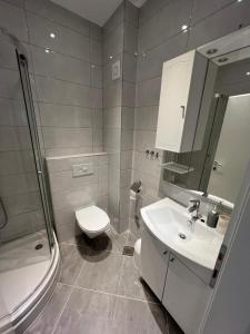 Koupelna v ubytování Apartments M&K + 14 fotografií