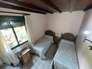 Postel nebo postele na pokoji v ubytování Casa Rincón de Claudia