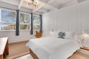 Un pat sau paturi într-o cameră la Ruschmeyers Hotel