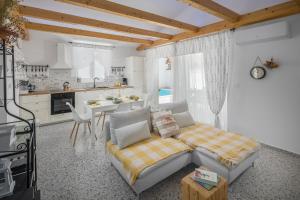 a living room with a couch and a kitchen at Spacious holiday house in Istria in Peroj
