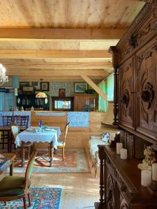 a large living room with a table and chairs at Villa Luca in Mosonmagyaróvár