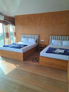 Ένα ή περισσότερα κρεβάτια σε δωμάτιο στο Sandy Beach Resort & Restaurant