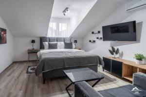 Postel nebo postele na pokoji v ubytování J&S Apartments