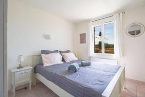 Łóżko lub łóżka w pokoju w obiekcie Villa piscine Lou Pitchoun
