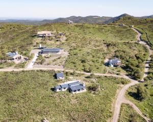an aerial view of a house on a hill at Cabaña Molle by Lugar in El Manzano