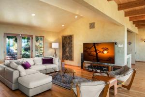 a living room with two couches and a tv at 3794 Forever Views II home in Carmel