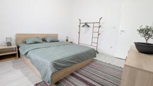 Postel nebo postele na pokoji v ubytování Main Square Apartment - Skopje