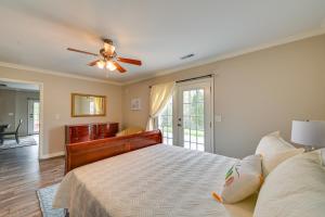 a bedroom with a bed and a ceiling fan at Home with Private Pool - 15 miles to Ark Encounter! in Berry +37 photos