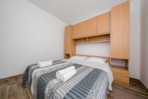 Postel nebo postele na pokoji v ubytování Apartments Gael