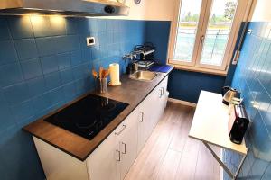 a kitchen with a sink and a counter top at Eco Villetta di Beppina con giardino - Self Check-in in Pratovecchio
