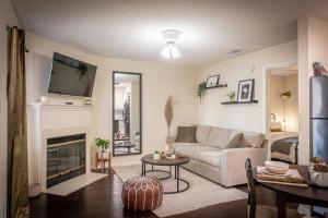 a living room with a couch and a fireplace at Lush, Enchanting Austin Oasis! in Austin