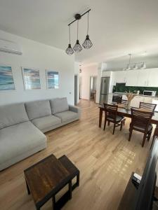 a living room with a couch and a table at Villa Delicia in Torrox